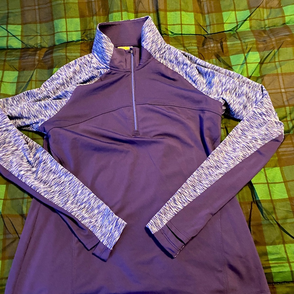 Danskin ladies sport top.  Quarter zippered.  Thumb holes.